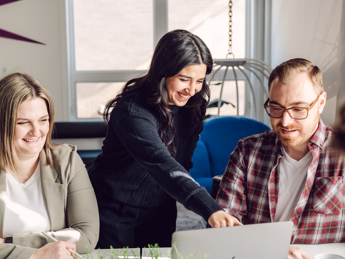 Bright Line team members reviewing financial results together on a laptop